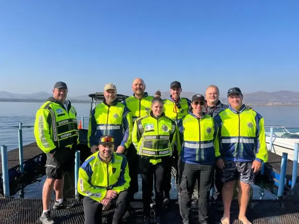 The unit's crew on a jetty in their hi-vis jackets